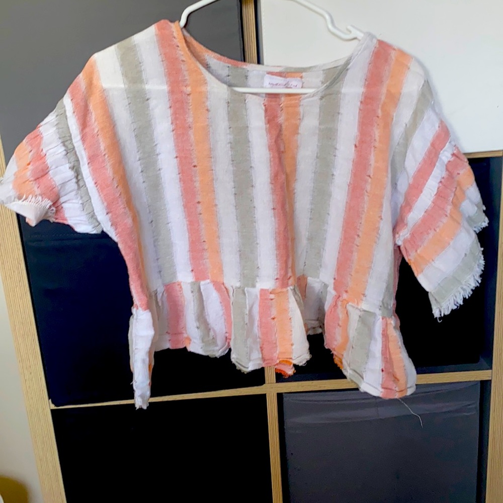 Orange, white and grey striped top.
